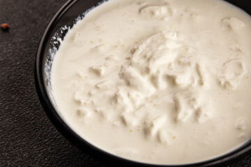 Stracciatella cheese soft young portion size Italian food natural product tasty snack fresh delicious gourmet food background on the table rustic top view copy space