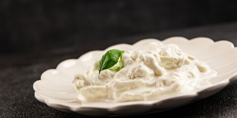 Stracciatella cheese soft young portion size Italian food natural product tasty snack fresh delicious gourmet food background on the table rustic top view copy space