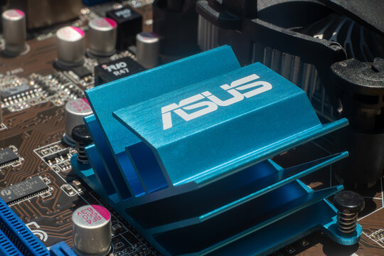 The Asus company logo on the computer's motherboard.The asus brand name is blue.