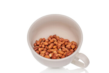 Peeled raw peanuts isolated on white background, close-up.