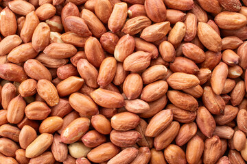 Peeled raw peanuts, top view, macro.