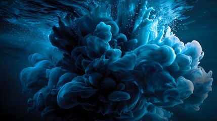 A mesmerizing cloud of dark blue ink gracefully swirling and diffusing in clear water, creating an abstract underwater scene