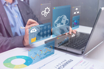 A professional analyzing data on a laptop, surrounded by digital graphs and cloud icons, representing modern technology and data management.