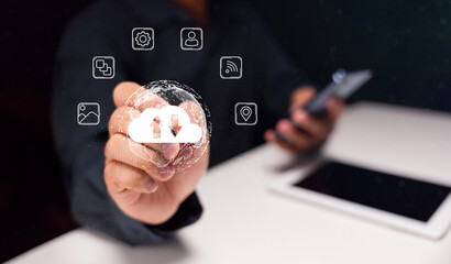 A person uses a digital interface to interact with cloud storage, showcasing technology and data management concepts.