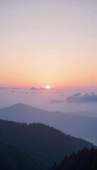 Fototapeta premium Serene Mountain Landscape at Sunrise with a Clear Sky and Tranquil Atmosphere, Capturing the Beauty of Nature and Panoramic Views Over Misty Hills