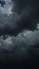 Dramatic display of dark storm clouds gathering ominously in the sky, hinting at an impending thunderstorm with heavy rain and powerful winds casting shadows below