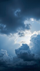 Majestic Towering Cumulonimbus Clouds Illuminated by Gentle Sunlight Amidst a Dramatic Sky Capturing Nature's Power and Beauty in a Serene Atmospheric Scene