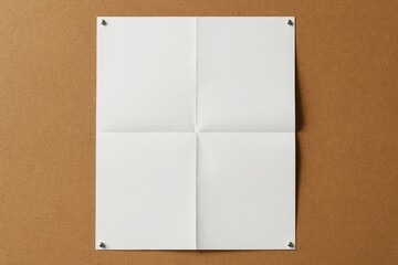 Blank white paper with fold marks pinned on cork board background, minimal light and shadow concept, top view flat graphic layout design style. Ai generative