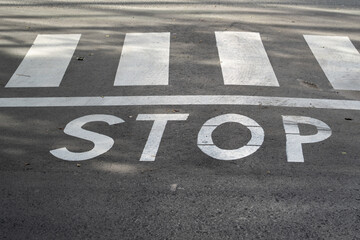 vehicles stop sign and pedestrian crossing sign
