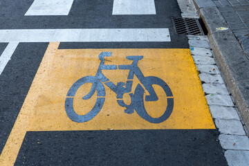 yellow bicycle lane sign
