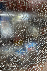 Texture of broken glass of shop showcase close up