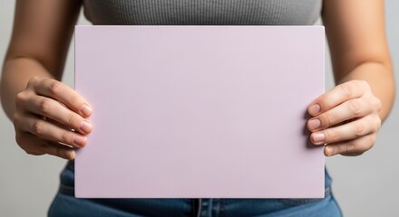 Woman's Hands Holding Blank Pale Pink Sign