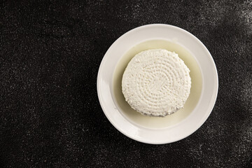 Cottage cheese fermented milk product portion size natural product tasty snack fresh delicious gourmet food background on the table rustic top view copy space keto and paleo diet