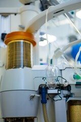 Surgical medical equipment. Medical apparatus with a glass container and connected tubing seen in...