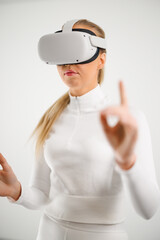 Woman wearing VR glasses against white background