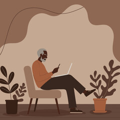 Elderly African American man comfortably uses a laptop and smartphone in a relaxed home setting. Represents modern seniors, digital connectivity, and remote work lifestyle.