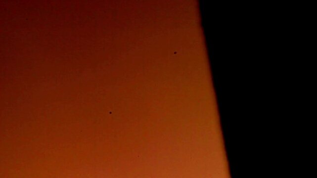 The film burn overlay in black background.