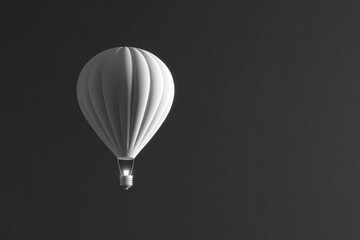 Single white hot air balloon against dark background