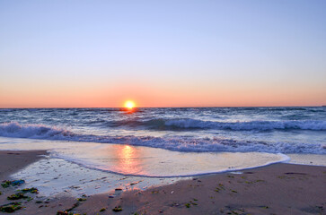 Sunrise. Dawn at sea. Beach.