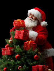 A man in a red suit is standing on top of a Christmas tree