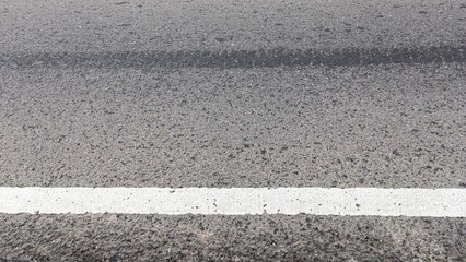 Fototapeta premium Asphalt road with white dividing line