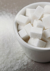 white sugar on the table on a light background close-up. Vertical photo format