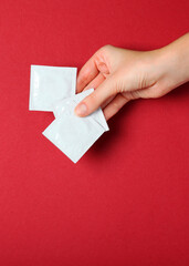 condoms and other contraceptives on a colored background. Vertical photo format