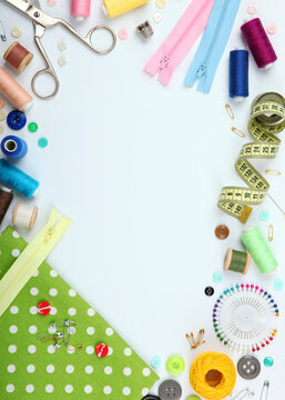 different sewing accessories on the table close-up. Vertical photo format