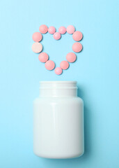pills on a colored background top view. Medicine, treatment, illness.. Vertical photo format