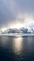 Panoramic view of a vast ocean under a dramatic sky