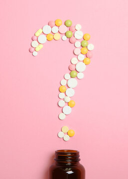 pills on a colored background top view. Medicine, treatment, illness.. Vertical photo format