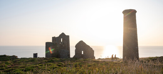 tower ruin of wheal coates near saint agnes in cornwall and hikers