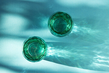 Glasses of water and  on a blue