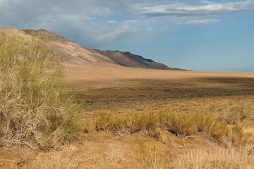 View of Small Kalkan Mountains and Katutau Mountains from Singing Dunes in Altyn Emel National Park. UNESCO Biosphere Reserve. Kazakhstan. Asia.