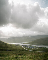 Village and Bridge in Mountain Valley on the Faroe Islands