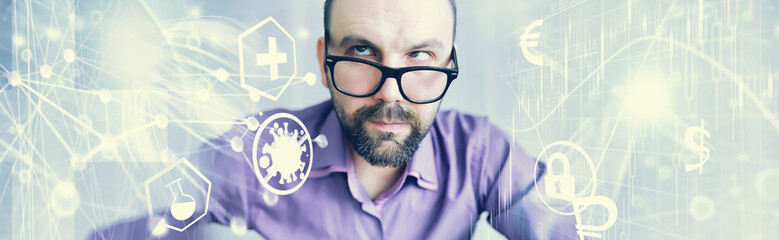 A cross-eyed bearded man is looking into the frame. Eye disease. The concept of an inexperienced...