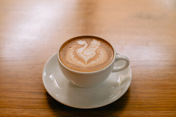 Latte art coffee in a white mug