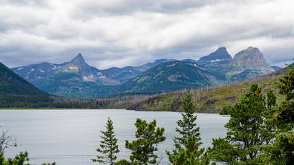 A varied trail where waterfalls highlight the changing beauty of mountains, lakes and forests in Waterton lake national park, Alberta, Canada