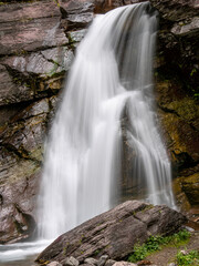 A varied trail where waterfalls highlight the changing beauty of mountains, lakes and forests in Waterton lake national park, Alberta, Canada