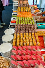 Festive colorful dessert spread. A vibrant spread of assorted desserts showcases an array of...