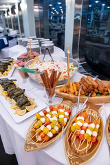 Evening buffet feast!. An array of appetizers and main dishes is elegantly set on a buffet table at...