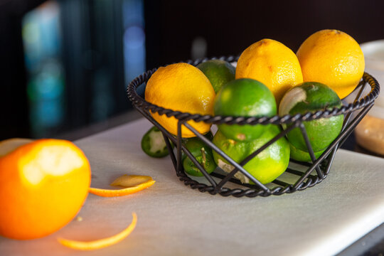 Lemons and Limes in a wired baskeet