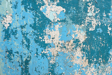 Abstract background, Old cracked blue and white paint on a wooden surface.