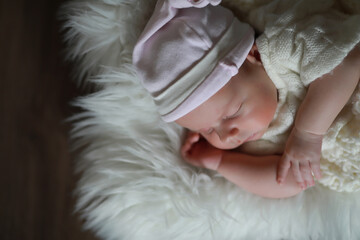 Baby newborn sleeping wrapped up in a blanket