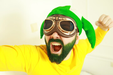 A man with a green beard. St.Patrick 's Day. Irish fan color beard.
