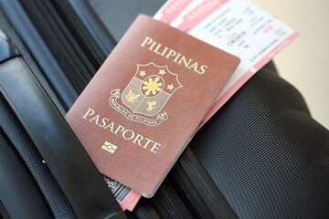 Philippines passport and avia tickets on travel bag. The concept of travel and vacation