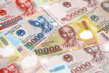 Vietnamese dong currency money bills. The current banknotes lies on table in big amount