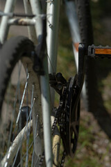 Detailed view of a bicycle crankset and chain, highlighting the components and structure of the bike. Perfect for cycling enthusiasts and mechanical illustrations.