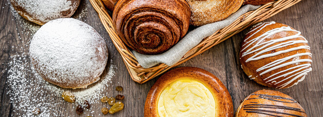 Fresh baked bread, various delicious freshly baked bread on white background, copy space. Variety of artisan bread composition, top view