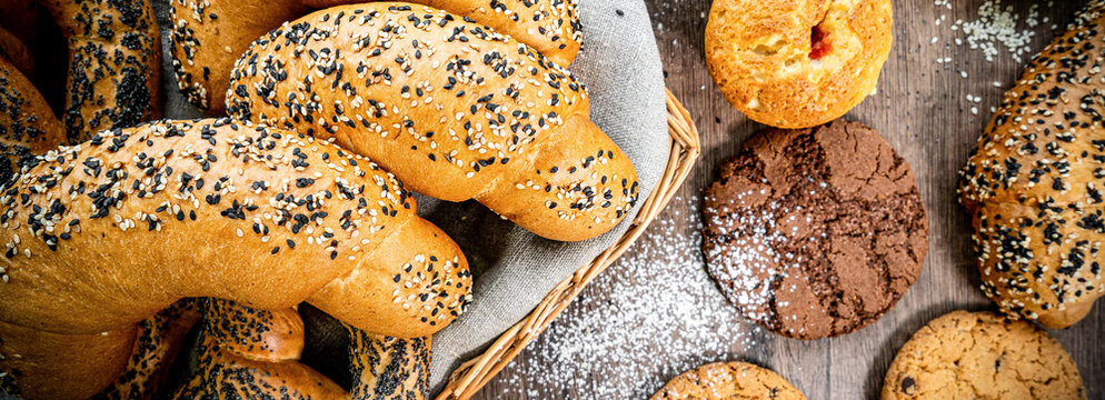 Fresh baked bread, various delicious freshly baked bread on white background, copy space. Variety of artisan bread composition, top view - Powered by Adobe